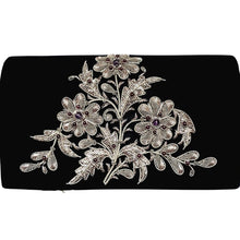 Load image into Gallery viewer, Luxury black velvet evening clutch bag embroidered with a bouquet of three flowers in antique silver and embellished with genuine amethyst and garnet gemstones, floral wedding clutch, black and silver zardozi purse.