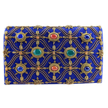 Load image into Gallery viewer, Side view of cobalt blue dupioni silk evening clutch bag embroidered with antique gold wave pattern and embellished with eight bezel set genuine gemstones including lapis lazuli, green onyx and jasper, art deco inspired Egyptian blue clutch, blue and gold zardozi purse.