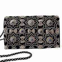 Load image into Gallery viewer, Luxury black velvet evening clutch bag embroidered with geometric pattern of eight sided stars and flowers in antique silver color and embellished with genuine lapis lazuli and garnet gemstones, formal clutch, silver and black zardozi purse.