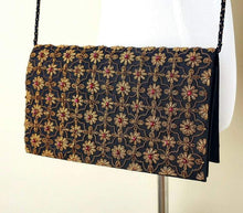 Load image into Gallery viewer, Black silk and copper clutch bag with garnets.