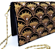 Load image into Gallery viewer, Side view of Art Deco inspired luxury black velvet evening clutch bag embroidered with peacock feather pattern or fish scale pattern in antique gold color and embellished with quartz gemstones, formal clutch, black and gold zardozi purse.