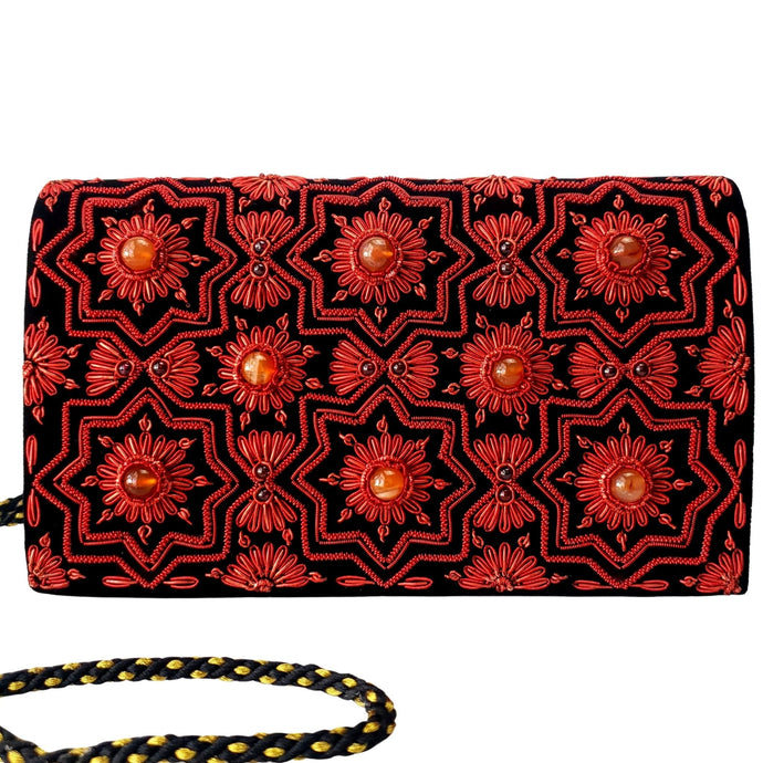 Black velvet handbag embroidered with red metallic flowers in geometric pattern and inlaid with gemstones BoutiqueByMariam.