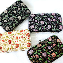 Load image into Gallery viewer, Collection of four floral metal frame clutches in different colors BoutiquebyMariam.
