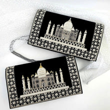 Load image into Gallery viewer, Two luxury black velvet evening clutch bags embroidered with white silver Taj Mahal with white silver floral border, one with gold accents, zardozi purse.