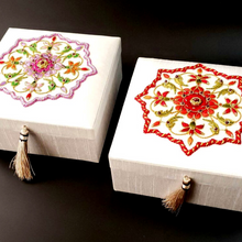 Load image into Gallery viewer, Two hand embroidered white silk wedding memory boxes, one with red flowers, the other with pink flowers.