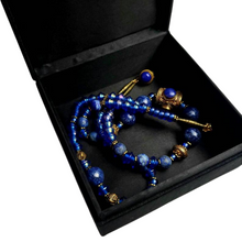 Load image into Gallery viewer, Sateen lining of jewelry box, interior view.