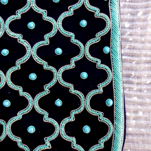 Load image into Gallery viewer, Luxury black velvet crossbody bag hand embroidered with turquoise geometric pattern and inlaid with turquoise stones, close up view.