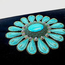 Load image into Gallery viewer, Hand embroidered turquoise blue silk flower on a black velvet minaudiere clutch bag inlaid with turquoise stone and aqua chalcedony gemstones, close up view.