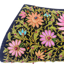 Load image into Gallery viewer, Hand embroidered black silk handbag with colorful flowers and embellished with star ruby and ruby gemstones, zardozi embroidery, close up view.