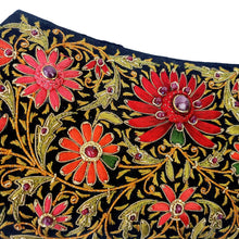 Load image into Gallery viewer, Luxury black silk evening clutch bag embroidered with gold work and red silk flowers and embellished with ruby gemstones, zardozi bag, close up view.