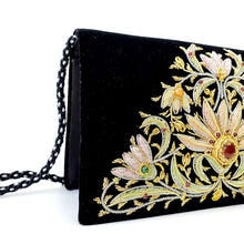 Load image into Gallery viewer, Side view of black velvet luxury evening clutch bag embroidered with pastel flowers in a central triangular pattern and embellished with genuine gemstones, floral wedding clutch, black and pastel zardozi purse.