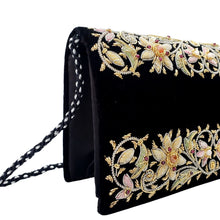 Load image into Gallery viewer, Side view of black velvet evening clutch bag embroidered with pastel flowers and embellished with genuine gemstones, floral wedding clutch, black and pastel colored zardozi purse.