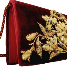 Load image into Gallery viewer, Side view of luxury claret red evening clutch bag embroidered with yellow gold central flower in triangular shape and embellished with genuine gemstones, opulent formal clutch, red and gold zardozi purse.