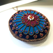 Load image into Gallery viewer, Hand embroidered Notre Dame Rose Window Paris holiday ornament, close up view. 
