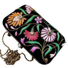 Load image into Gallery viewer, Black velvet hard case clutch embroidered with floral design, top view.
