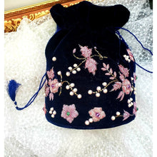Load image into Gallery viewer, Luxury hand embroidered navy blue velvet potli bag or drawstring pouch bag embroidered with pink metallic flowers, zardozi potli bag.