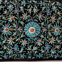 Load image into Gallery viewer, Hand embroidered turquoise blue flowers with central rubies, close up view. 
