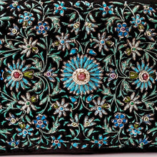 Load image into Gallery viewer, Hand embroidered turquoise blue flowers with central rubies, close up view.