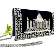 Load image into Gallery viewer, Side view of luxury black velvet evening clutch bag embroidered with white silver Taj Mahal with white silver floral border, silver and black zardozi purse.