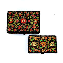 Load image into Gallery viewer, Two hand embroidered black velvet memory boxes, one red flowers, the other orange flowers., inlaid with semi precious gemstones. 
