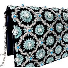 Load image into Gallery viewer, Side view of luxury black velvet evening clutch bag embroidered with silver cloverleaf pattern and turquoise blue flowers and embellished with moonstones and turquoise stones, formal purse, black and silver and blue zardozi purse.