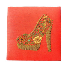 Load image into Gallery viewer, Embroidered orange silk keepsake box with bronze womens stiletto shoe BoutiqueByMariam. 

