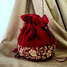 Load image into Gallery viewer, Indian wedding clutch bag in red velvet embroidered with gold flowers, zardozi embroidery.