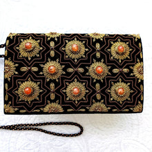 Load image into Gallery viewer, Luxury black velvet evening clutch bag embroidered with geometric pattern of eight sided stars and flowers in antique gold color and embellished with genuine carnelian gemstones, formal clutch, gold and black zardozi purse.