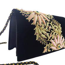 Load image into Gallery viewer, Side view of black velvet luxury evening clutch bag embroidered with two large pink and orange flowers on the bias and embellished with genuine gemstones, floral wedding clutch, black and orange and pink zardozi purse.