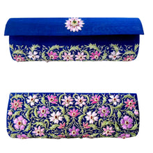 Load image into Gallery viewer, Marine-blue-silk-barrel-clutch-embroidered-front-and-back-with-lavender-flowers-and-embellished-with-rubies-and-emerald-gemstone.
