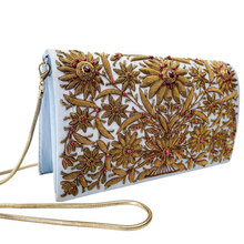 Load image into Gallery viewer, Statement blue silk evening bag embroidered with copper flowers and rubies, side view.