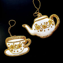 Load image into Gallery viewer, Tea cup and tea pot hand embroidered Christmas ornament gold on white velvet BoutiqueByMariam.
