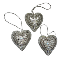 Load image into Gallery viewer, Set of two hand embroidered silver heart hanging ornaments.