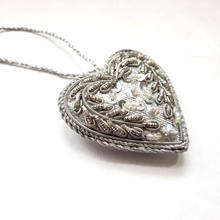 Load image into Gallery viewer, Silver hand embroidered heart ornament, side view.