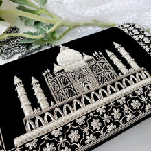 Load image into Gallery viewer, Close up view of luxury black velvet evening clutch bag embroidered with white silver Taj Mahal with white silver floral border, silver and black zardozi purse.