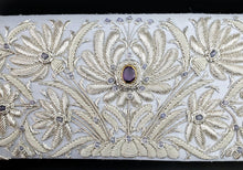 Load image into Gallery viewer, Luxury silver embroidered floral slim clutch on pale blue silk and embellished with amethyst gemstones, zardozi work, close up view.