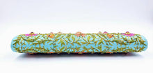 Load image into Gallery viewer, Turquoise blue clutch embroidered with multicolor flowers and embellished by star rubies, zardozi purse, bottom view.