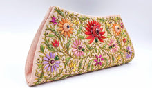 Load image into Gallery viewer, Peach silk clutch bag with multicolored silk flowers and central red lotus flower embellished with star rubies, zardozi purse, side view.