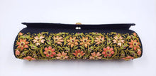 Load image into Gallery viewer, Formal black silk evening clutch bag embroidered with orange flowers all over and embellished with rubies, bottom view.
