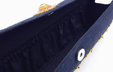 Load image into Gallery viewer, Interior of black silk clutch showing gathered full length pocket. and snap closure.