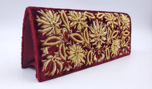 Load image into Gallery viewer, Luxury burgundy red velvet clutch bag embroidered with gold metallic flowers and embellished with star rubies, zardozi purse, side view.
