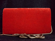 Load image into Gallery viewer, Orange velvet clutch bag embroidered with metallic copper flowers and embellished with star rubes, zardozi evening bag, gold tone strap, back view.