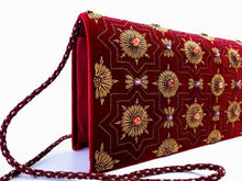 Load image into Gallery viewer, Burgundy velvet clutch embroidered with copper metallic medallions and embellished with semi precious stones, zardozi evening bag, cord strap, side view. 
