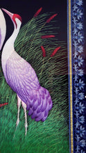 Load image into Gallery viewer, Embroidered bird silk wall art, two standing cranes with purple feathers embroidered on black velvet with an ornate border, framed, zardozi art, close up view of border.
