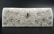 Load image into Gallery viewer, Bridal clutch in ivory velvet embroidered with silver lotus flowers and embellished with amethyst, zardozi evening bag.