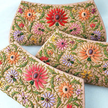 Load image into Gallery viewer, Set of three peach silk clutch embroidered with multicolor flowers and large central lotus flower, either red, orange, or coral pink, zardozi purse.