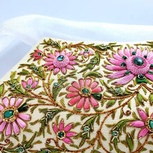 Load image into Gallery viewer, Gold silk clutch embroidered with pink flowers and embellished with emeralds, zardozi handbag, close up view. 
