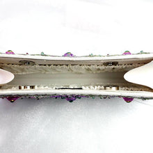 Load image into Gallery viewer, Exclusive luxury cream silk clutch embroidered with purple pink flowers and embellished with emeralds and rubies, interior view.
