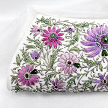 Load image into Gallery viewer, Hand embroidered luxury white silk clutch embroidered with lavender and pink flowers and embellished with emeralds and rubies, zardozi clutch bag, close up. 
