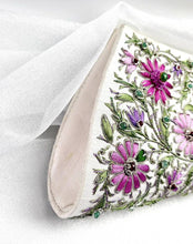 Load image into Gallery viewer, Lavender purple and pink lotus flower embroidered on white silk clutch and embellished with emeralds and rubies, zardozi handbag, side view.